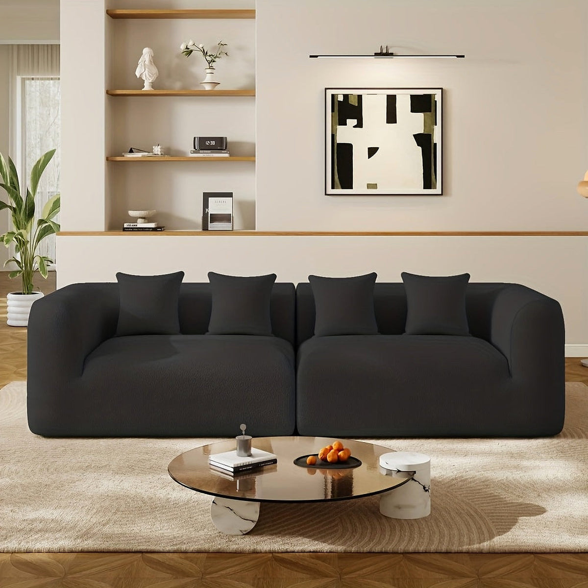 Curved Chenille Modular Sofa in Black, shown from the front with four matching pillows.