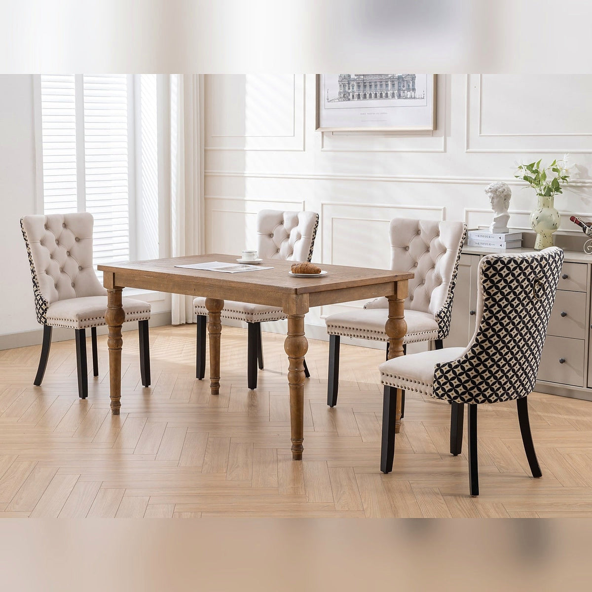 Beige velvet dining chair with a patterned back and dark wood legs