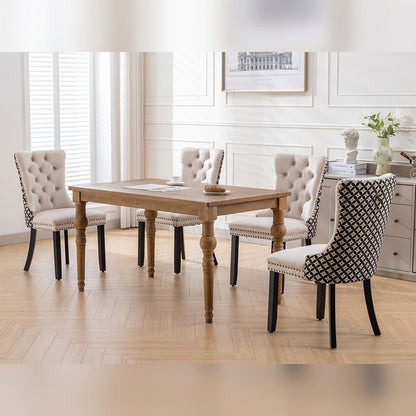 Beige velvet dining chair with a patterned back and dark wood legs
