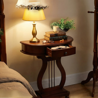 Cherry brown harp-base console with its single drawer open below a table lamp.
