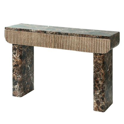 Angled view of the dark marble-look console with fluted drawer fronts.