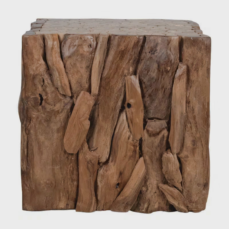 Studio view of the cube end table's irregular natural-brown side