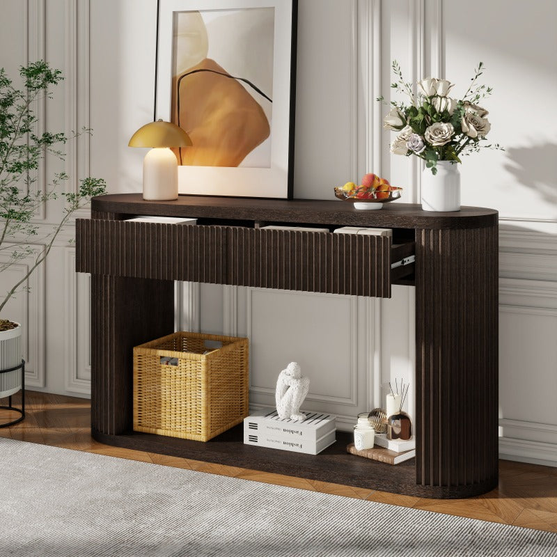 Espresso fluted oval console with two drawers partly open and baskets on the lower shelf