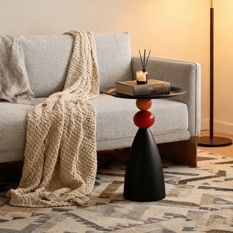 Black side table with colored spheres