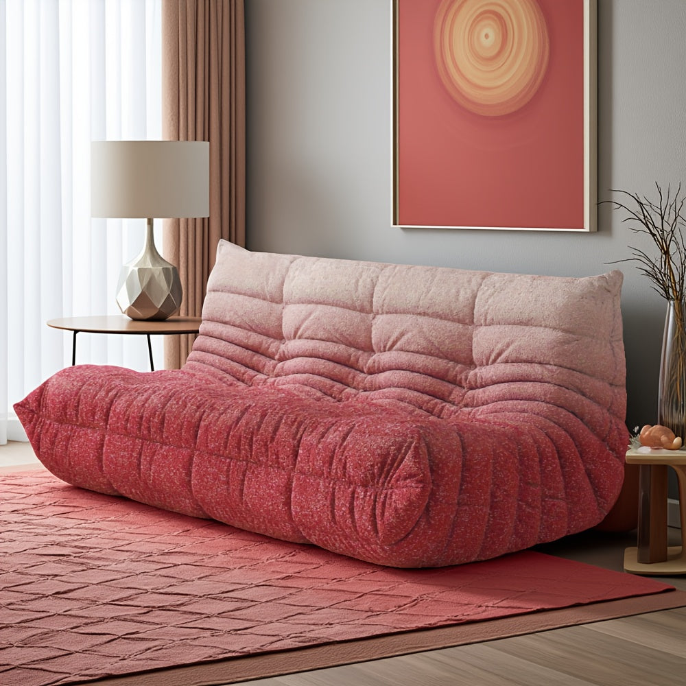 Red-and-white cushioned floor sofa beside a lamp