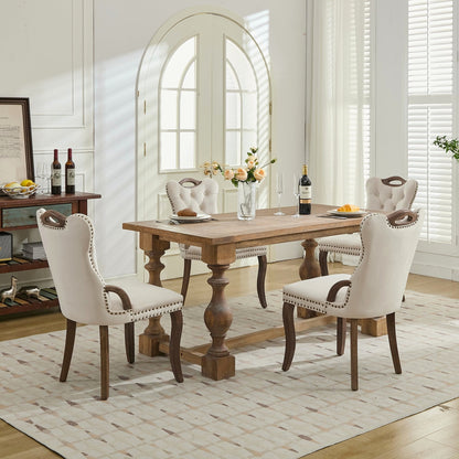Beige velvet dining chair with a tufted back, wood handle, and curved wood legs
