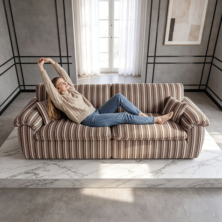 Wren Green Striped Deep-Seat Cloud Sofa — brown colorway reference shown with a lounging person; available option is green