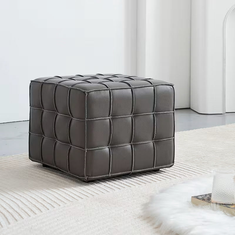 Square Tufted Ottoman — gray grid-tufted ottoman in a room