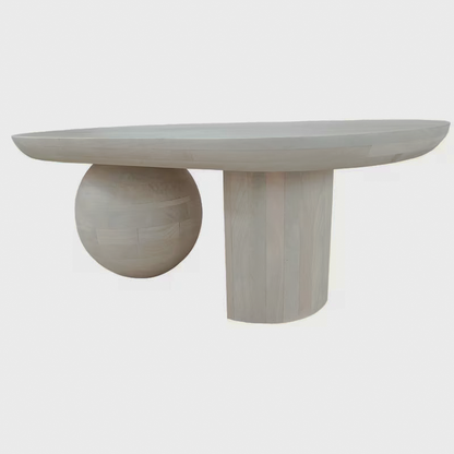 Side view of the washed-white coffee table and sculptural supports