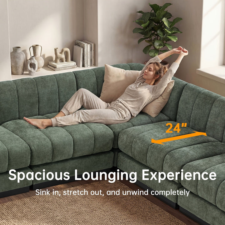 A person lounging on the green sectional beside a graphic marking the seat depth.