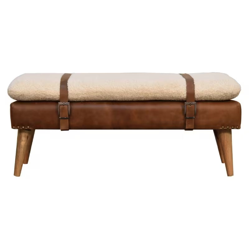 Front view of cream and brown bench with two buckle straps and tapered wood-tone legs