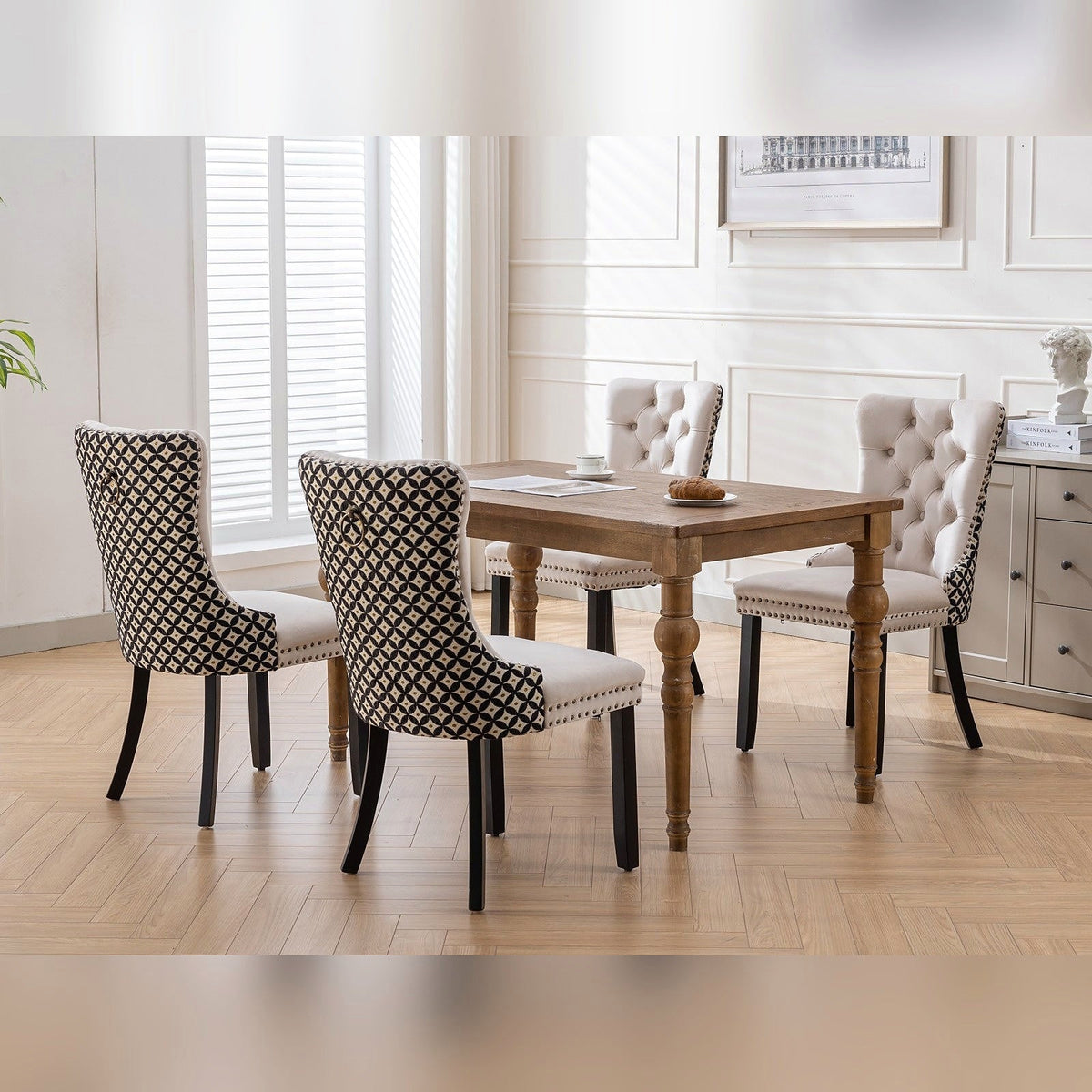 Beige velvet dining chair with a patterned back and dark wood legs