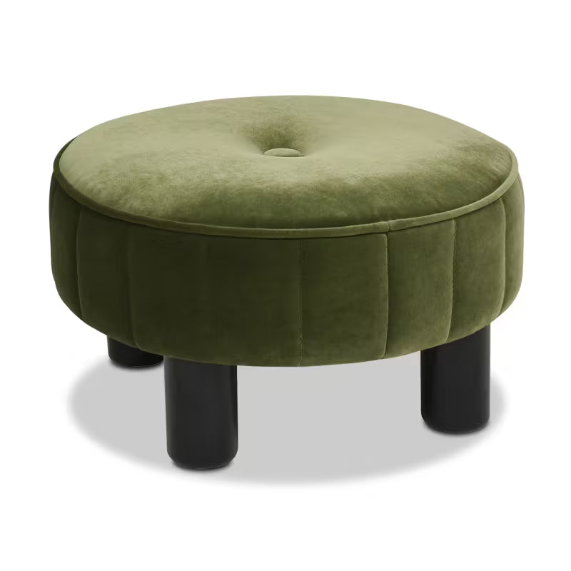 Angled view of green button-tufted ottoman