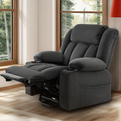 Gray padded recliner showing the extended footrest and dark mechanism below