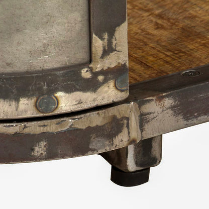 Close-up of the TV stand's distressed metal corner, rivets, wood shelf, and low foot.