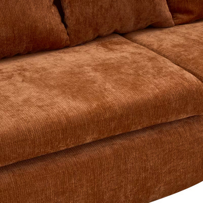 Close-up of the textured orange sofa upholstery and seat cushion