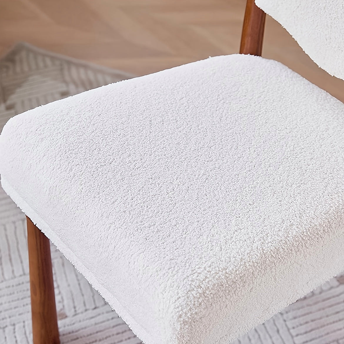 Ivory textured dining chair with a turned wood frame
