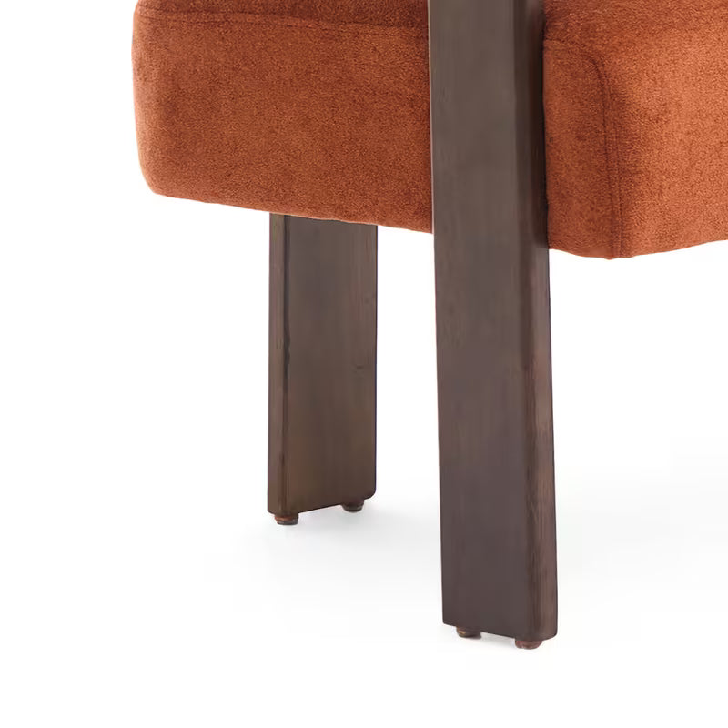 Rust Upholstered Loveseat with Wood Frame — wood leg and upholstered base close-up.