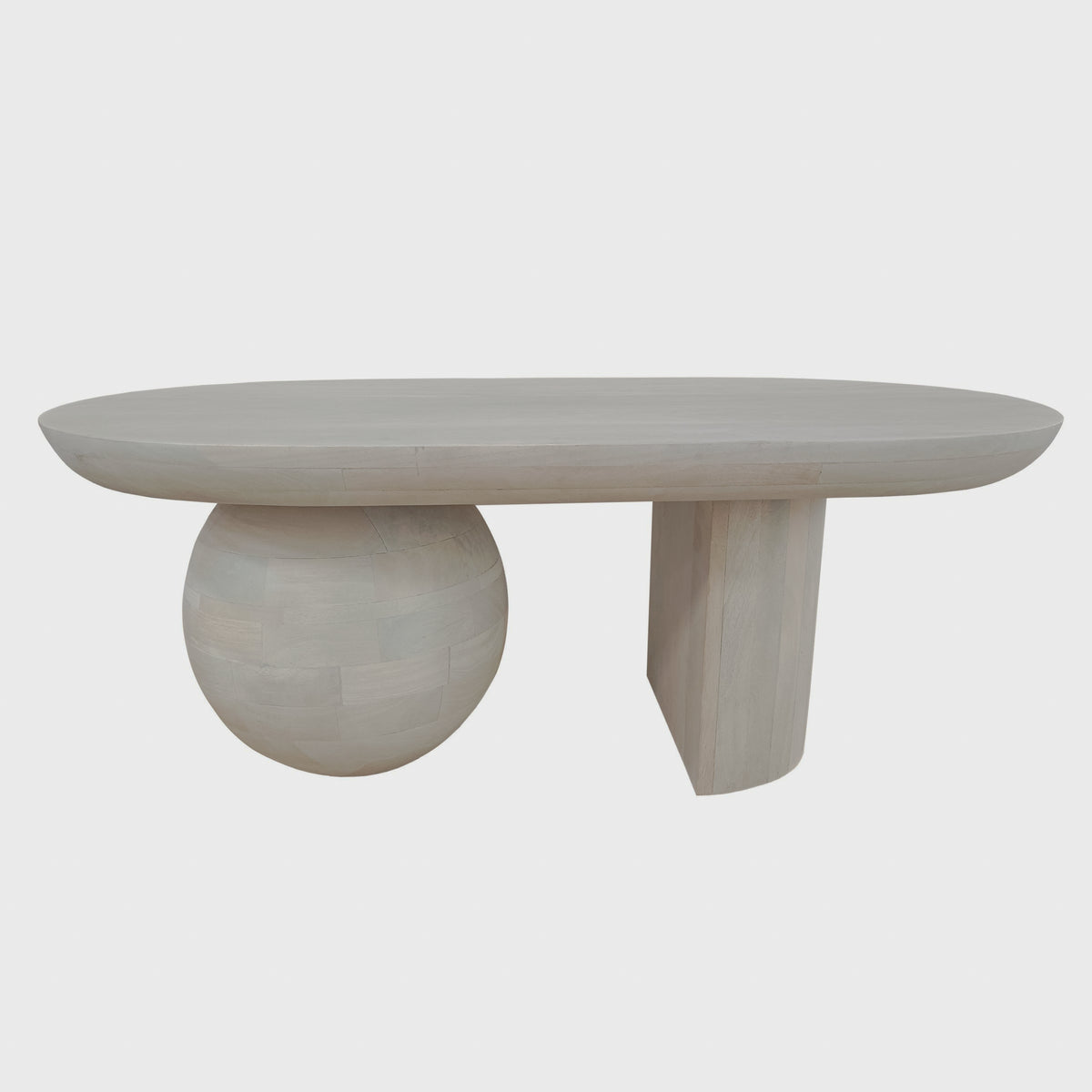 Washed-white coffee table with ball and slab supports on white