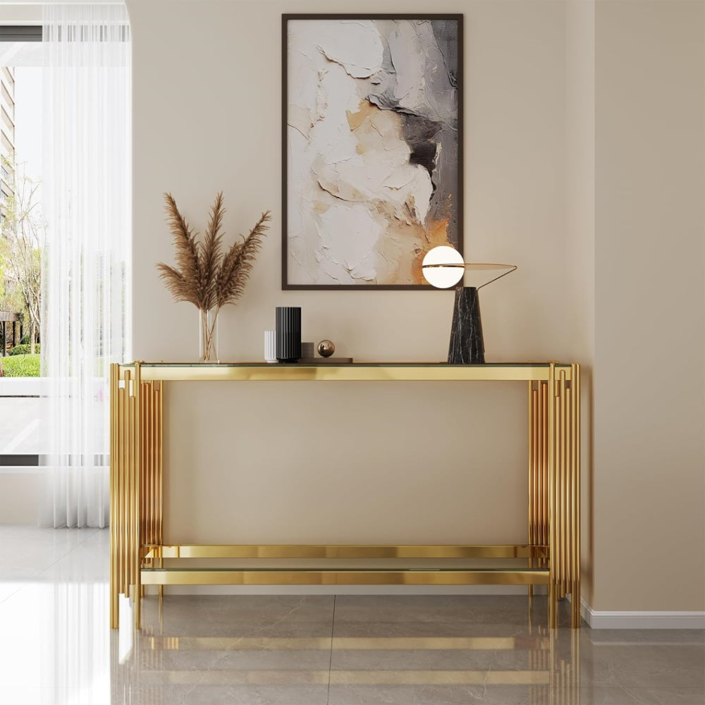 Front room view of the clear glass and gold frame console.