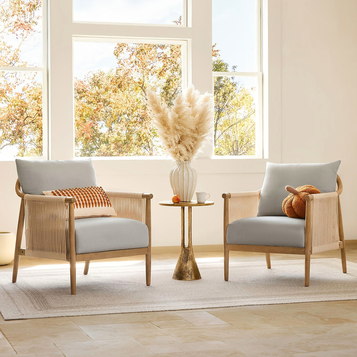 Wood frame accent chair with braided paper cord sides and a light gray cushion