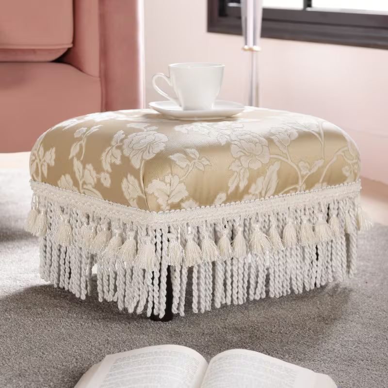 Champagne Floral Jacquard Footstool — champagne beige floral footstool beside a sofa