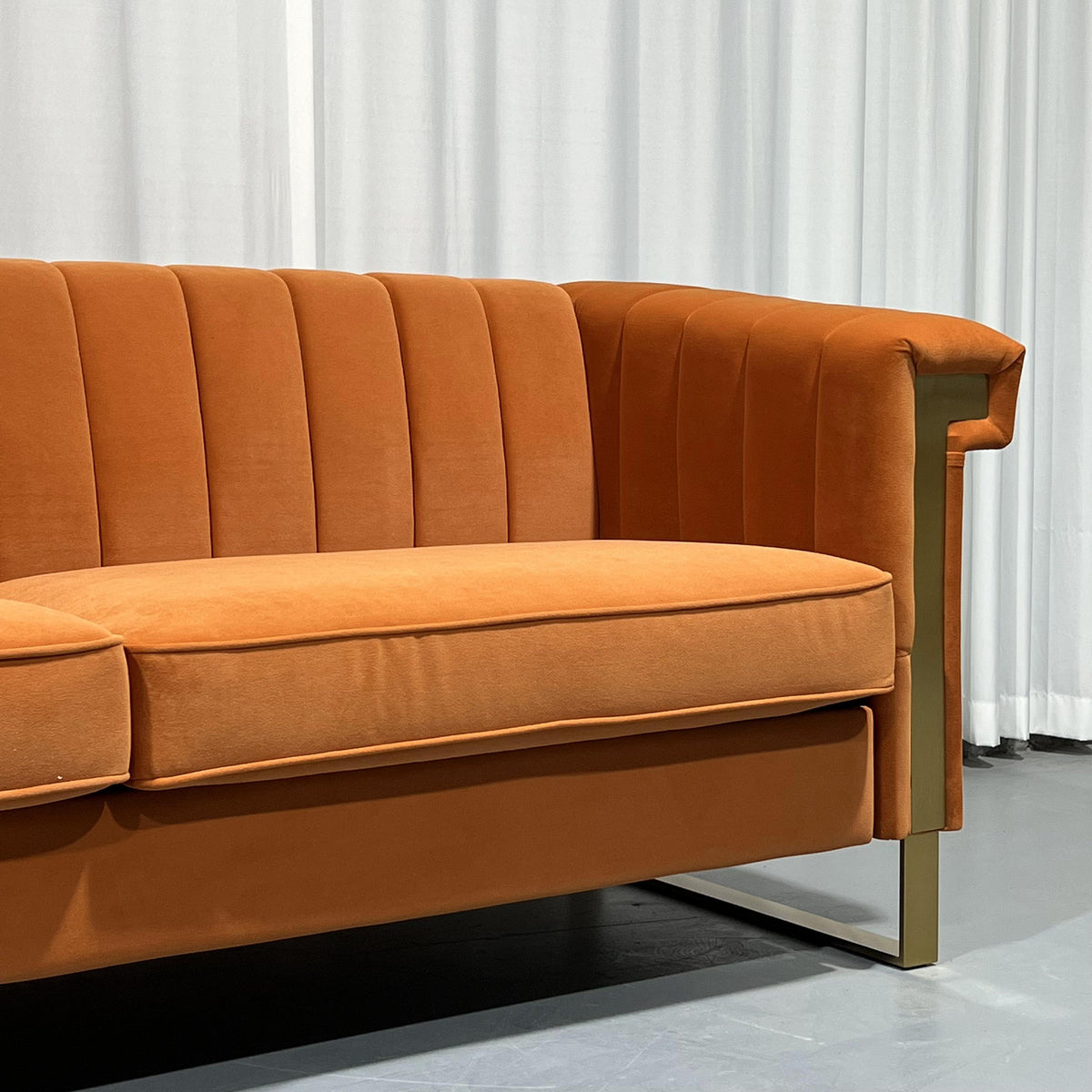 Orange Channel-Tufted Velvet Sofa — seat cushions and tufted back detail.