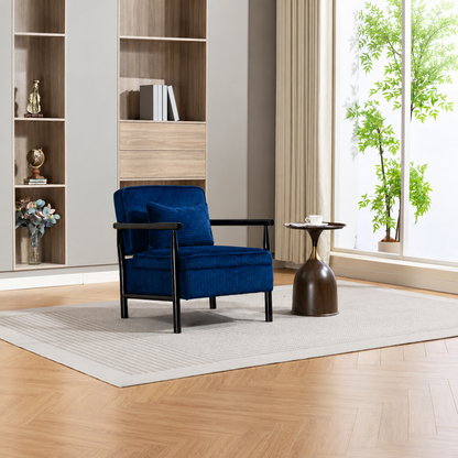 Navy Ribbed Accent Chair with Hidden Storage — navy chair in a bright living room.