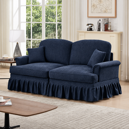 Navy Chenille Loveseat with Ruffled Skirt — navy loveseat with skirt in a living room.