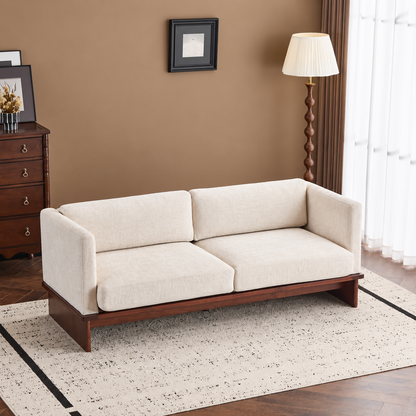 Square-Arm Boucle Sofa with Wood Base — cream sofa in a warm living room.