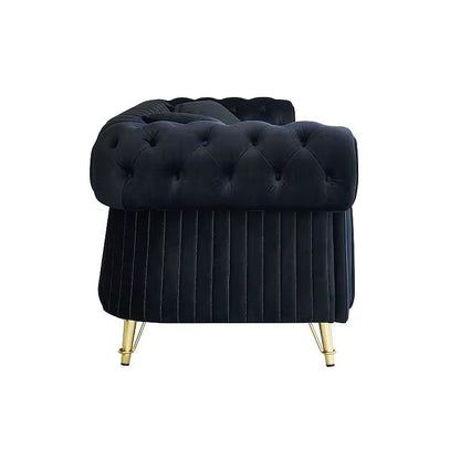 Side view of the black velvet Chesterfield sofa rolled arm and gold-tone feet