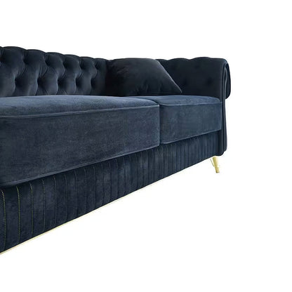 Close-up of the black velvet sofa seat cushions and channeled lower apron