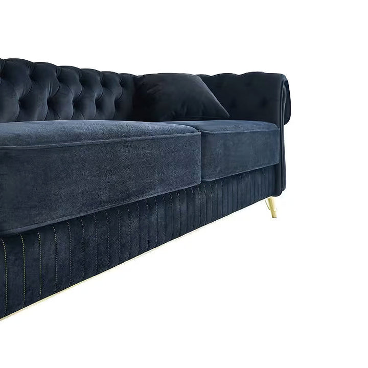 Close-up of the black velvet sofa seat cushions and channeled lower apron