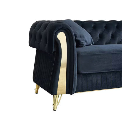 Close-up of the Chesterfield sofa rolled arm and gold-tone accent panel