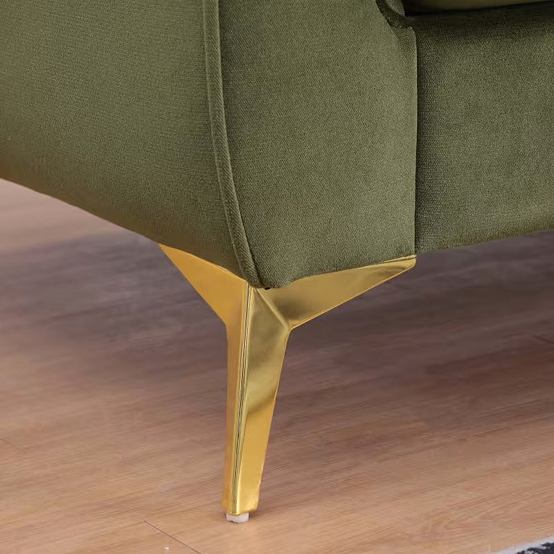Close-up of the Stanford sofa gold-tone angled leg and upholstered corner