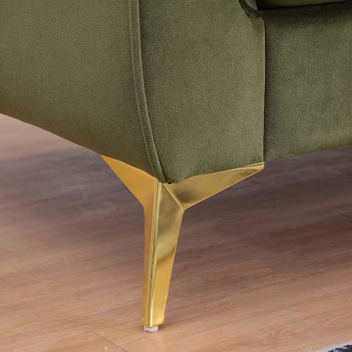 Close-up of the Stanford sofa gold-tone angled leg and upholstered corner