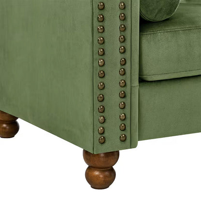 Green velvet rolled arm with nailhead trim and a turned wooden-style foot