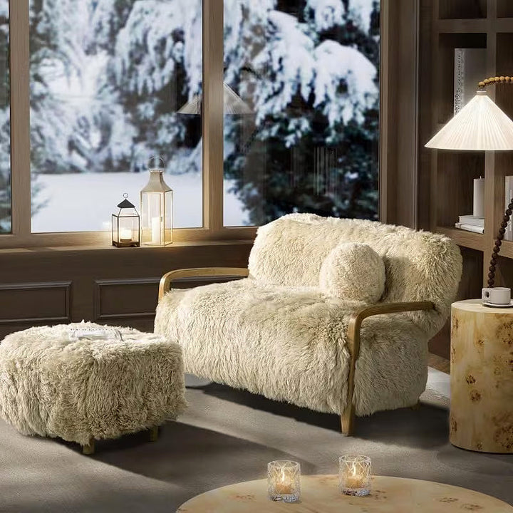 Enchante Sheepskin Accent Loveseat — winter room setting with a separate ottoman
