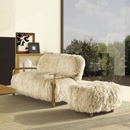 Enchante Sheepskin Accent Loveseat — beside a window with a separate ottoman shown