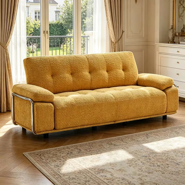 Alden yellow tufted sofa with steel armrest frame