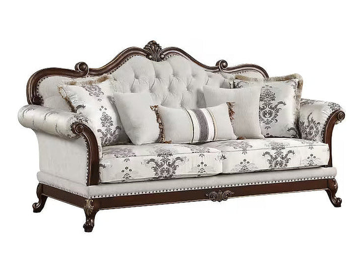 Gloria ivory sofa with patterned cushions, angled front view