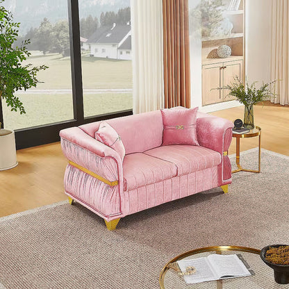 Aurelia pink velvet loveseat with gold-tone trim in a sitting room