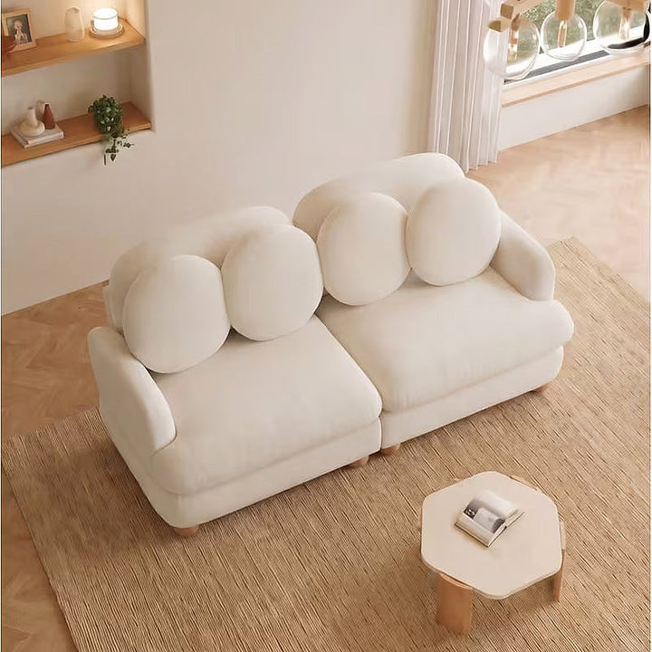 Clover beige loveseat, elevated angled view