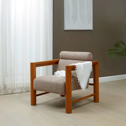 Nikolas Light Brown Bouclé Accent Chair — light brown chair with a throw in a room