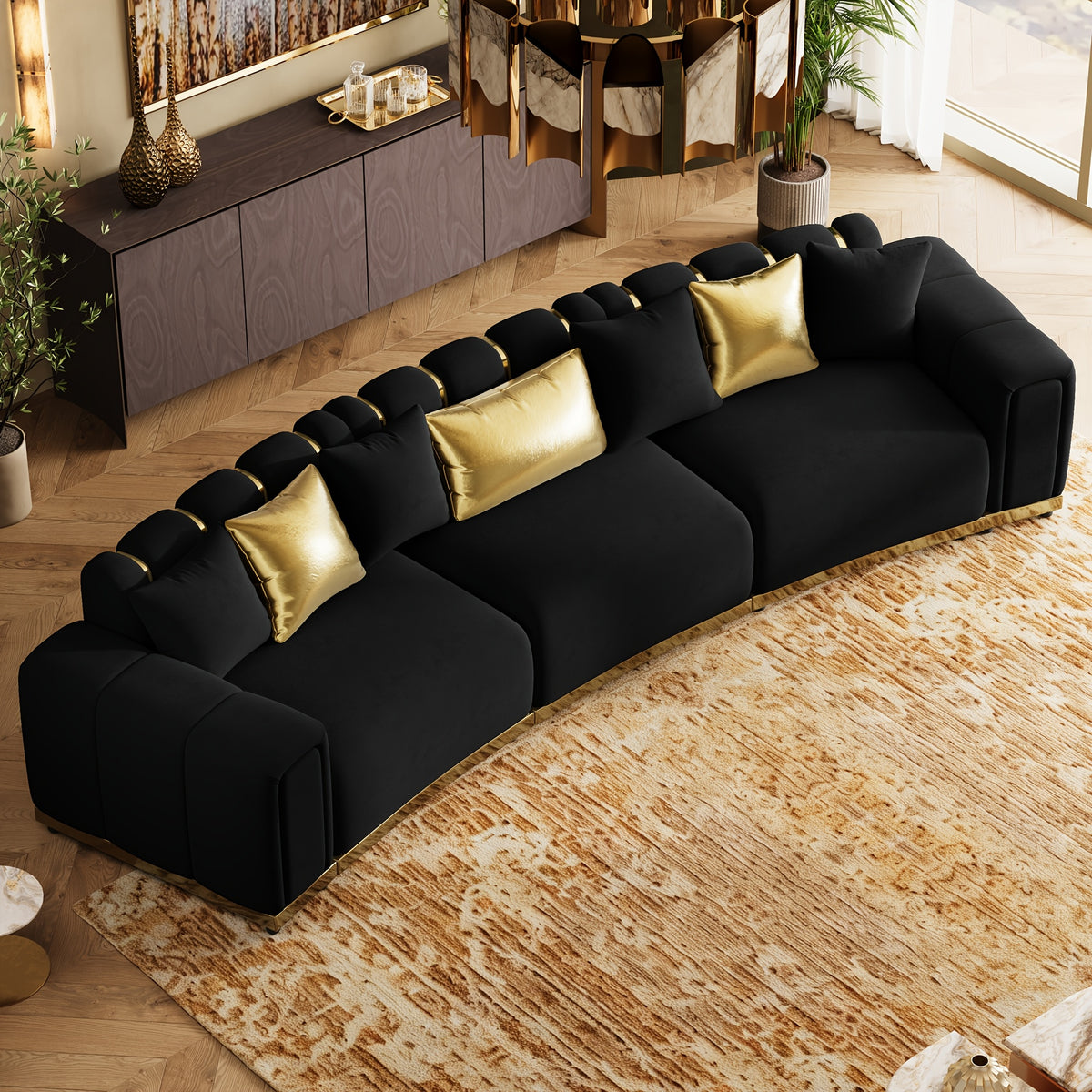 Curved Velvet Sofa with Metal Trim — overhead view of black sofa and trim.