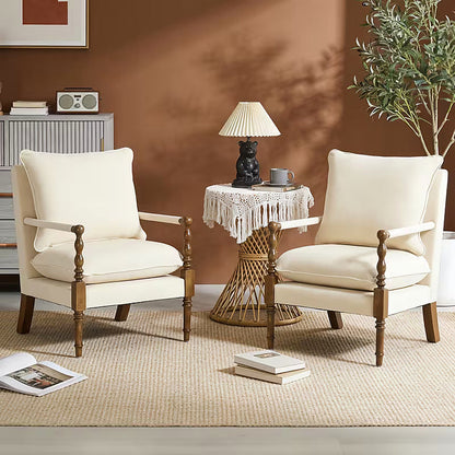 Beige upholstered accent chair with turned wood front posts — upholstery option