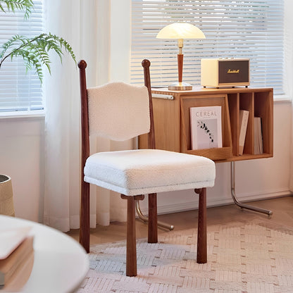 Ivory textured dining chair with a turned wood frame