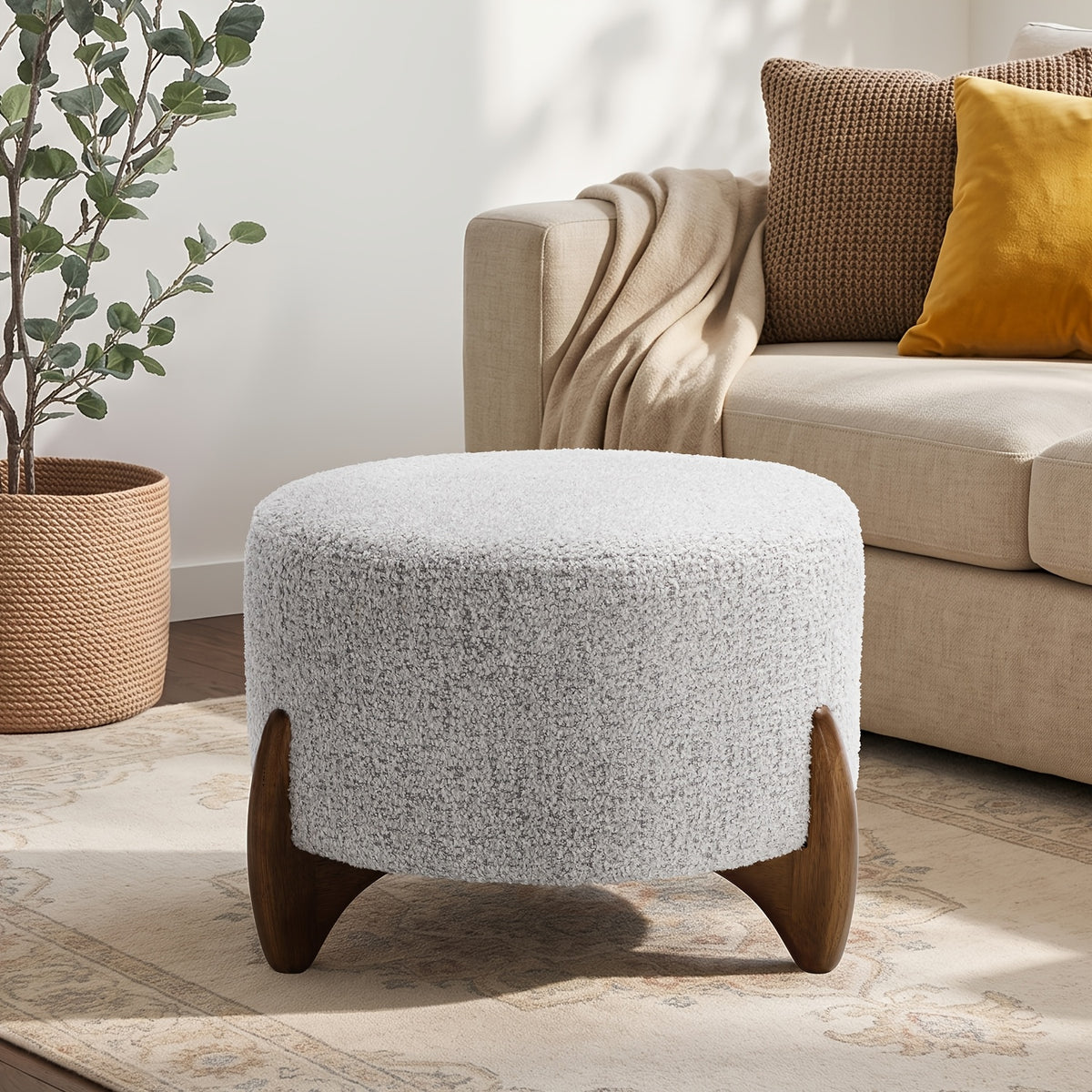 Gray ottoman beside a sofa