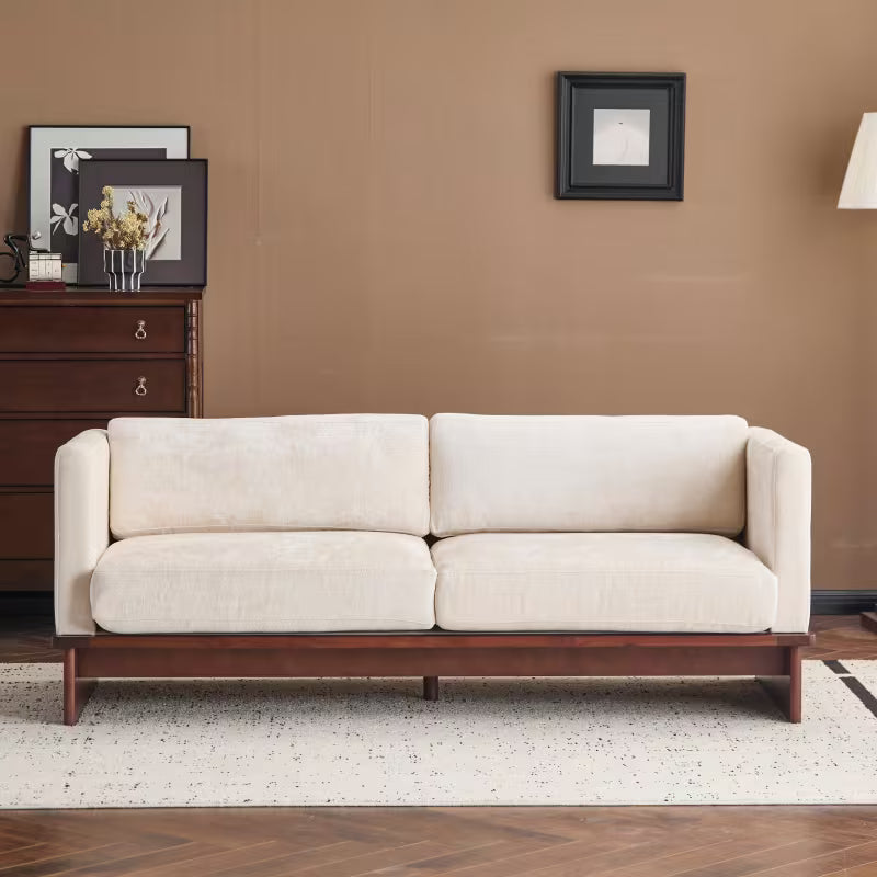 Square-Arm Boucle Sofa with Wood Base — front view in a living room.