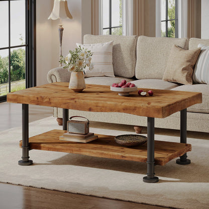 Front angle of brown two-tier coffee table beside a sofa